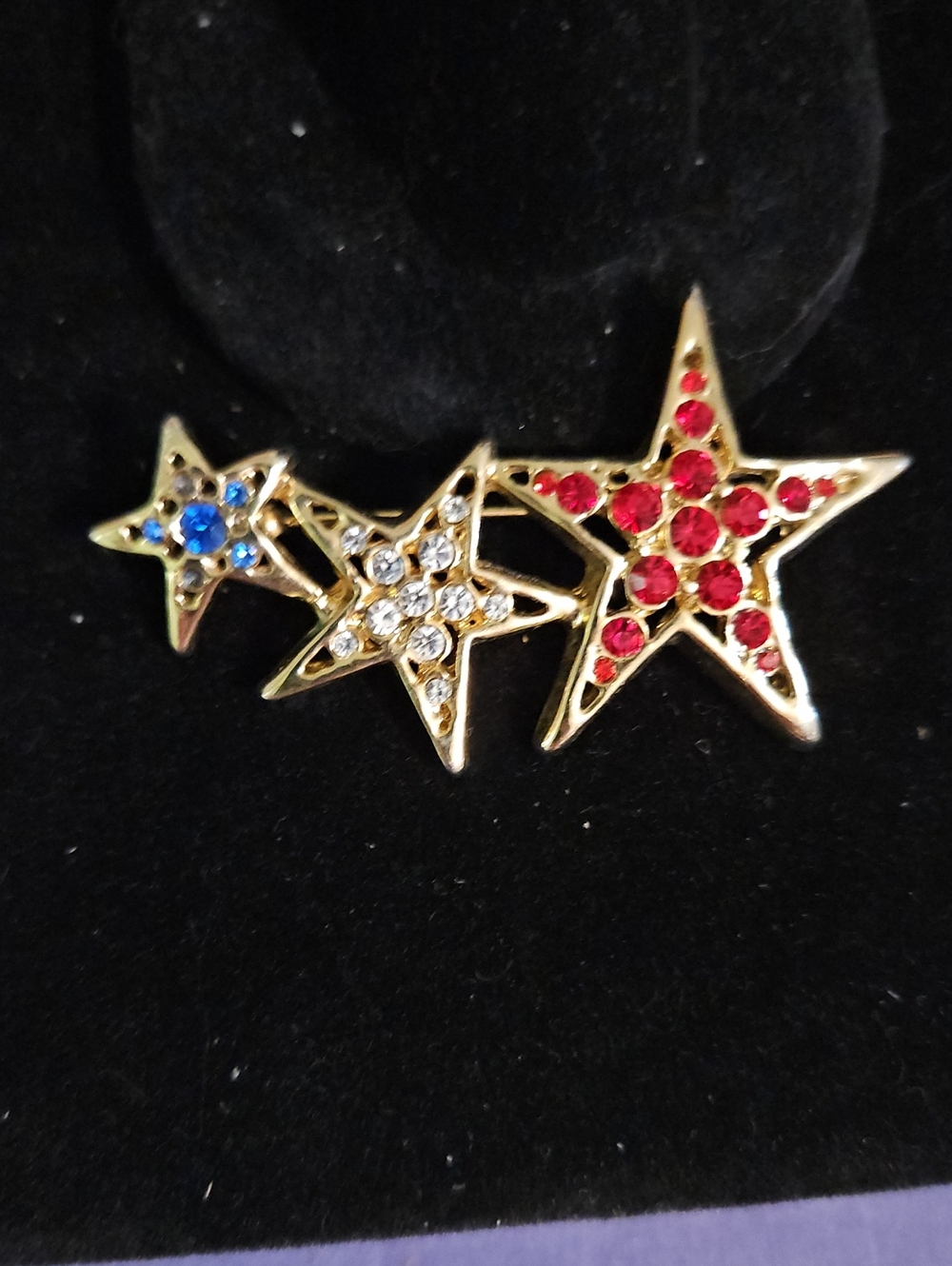 Gold-Tone Triple Star Brooch with Red, Clear and Blue Stones